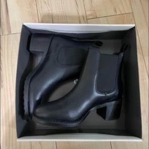 Cougar brand black heeled boots. Never worn, still in box. Size Women’s 9.